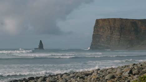 Slow-motion-shot-of-the-rocky-beach-on-the-Atlantic-Ocean-in-Portugal