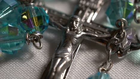 close up of a jesus cross and beads