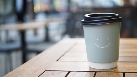 paper coffee cup with smile face design