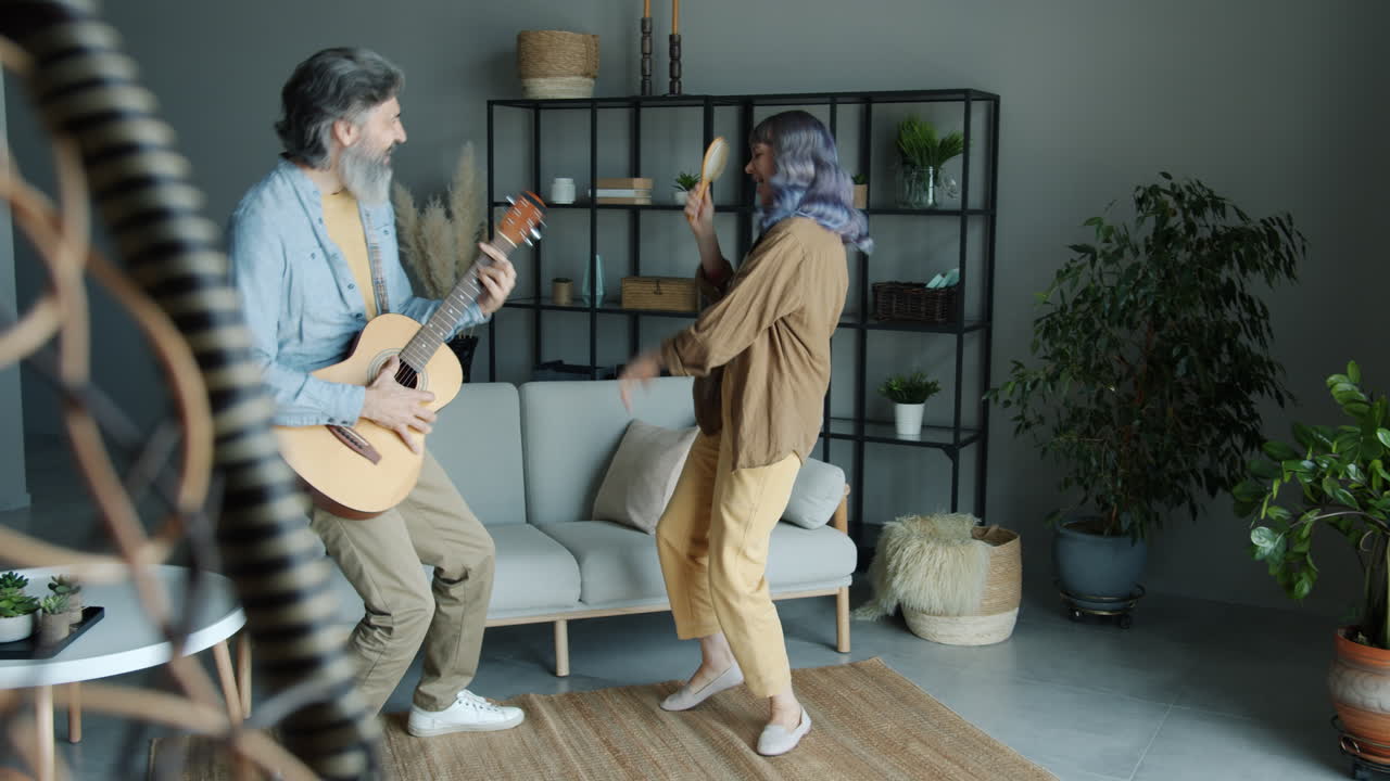 Couple Singing and Dancing at Home