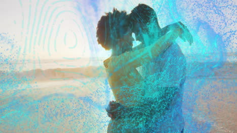 embracing couple with animation of abstract blue and green patterns overlaying