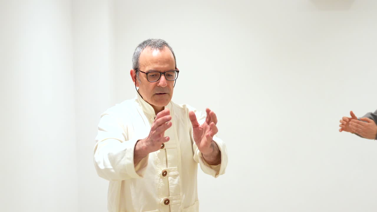 A man indoors with a white background
