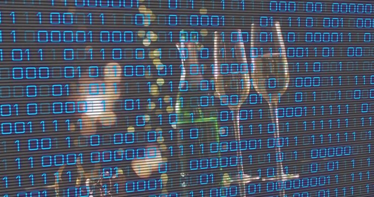 Champagne bottle and flutes receiving binary overlay, scanner sweeping down creating matrix effect