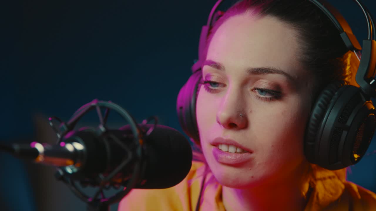 Young radio host talking into the microphone