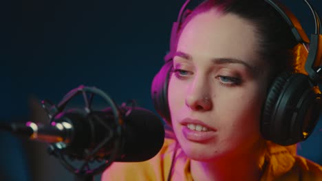 young radio host talking into the microphone