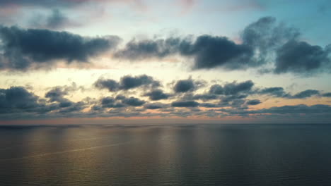 static dron flying over seaafter sunset