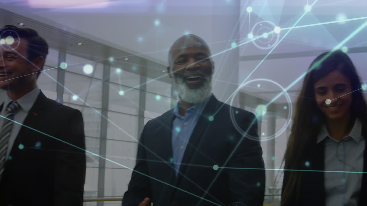 Animation of network of connections over happy diverse group of businesspeople walking at office