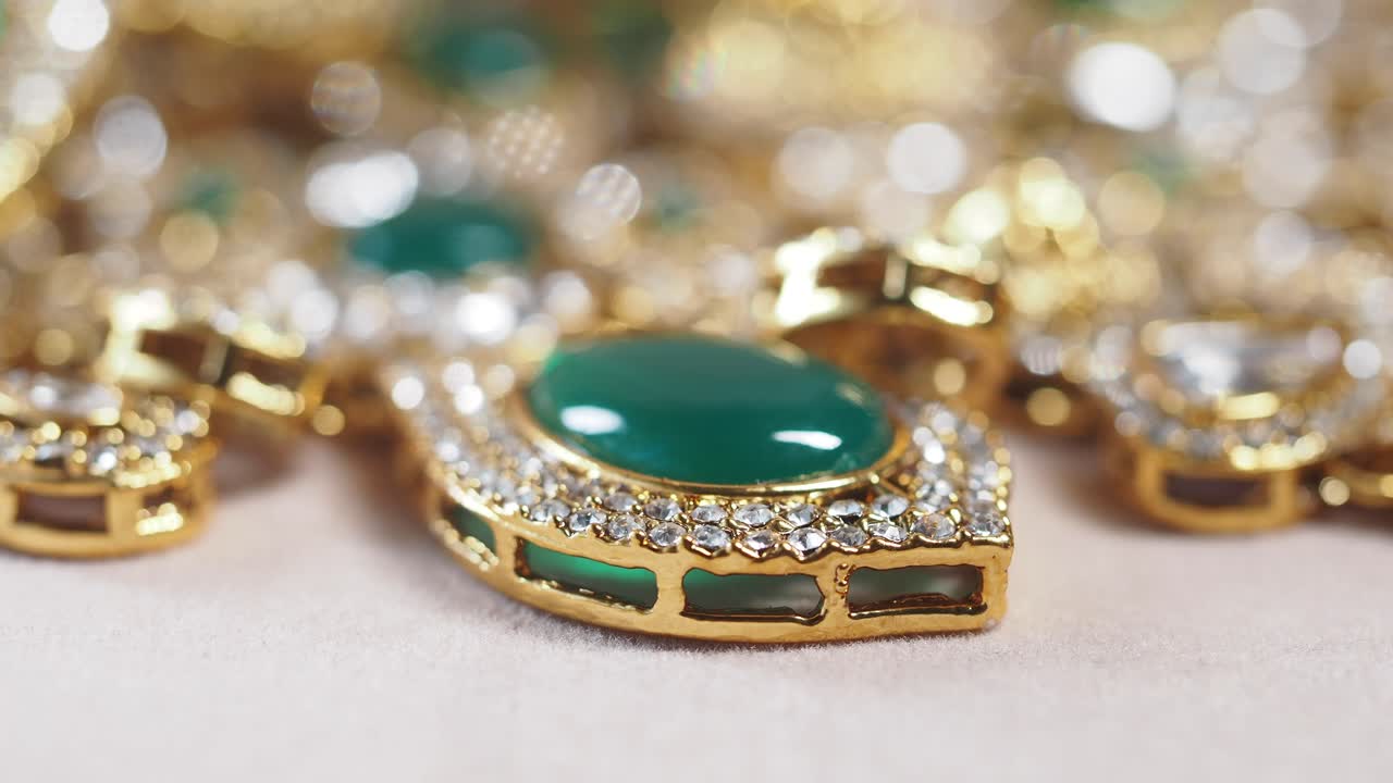 Close-up of a Gold Necklace with Green Gemstone Pendant