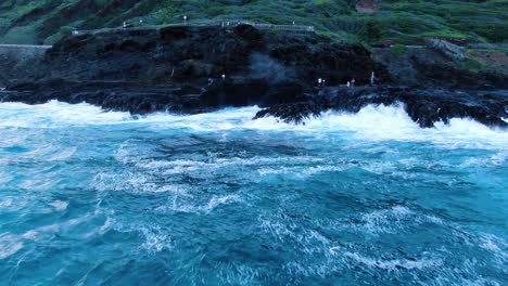 Halona-Blowhole-on-a-rough-day-as-tourists-stand-close-and-watch