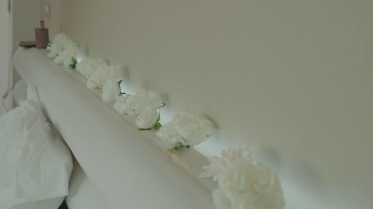 soft white flowers decorating a bedroom wall interior