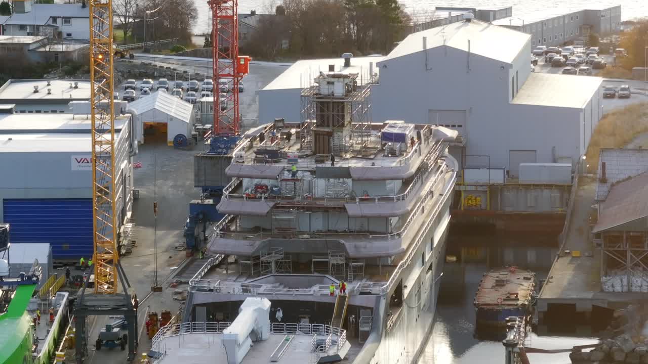 Close-up drone shot of the research vessel "REV Ocean" docked at VARD shipyards in S&oslash;vik, Norway