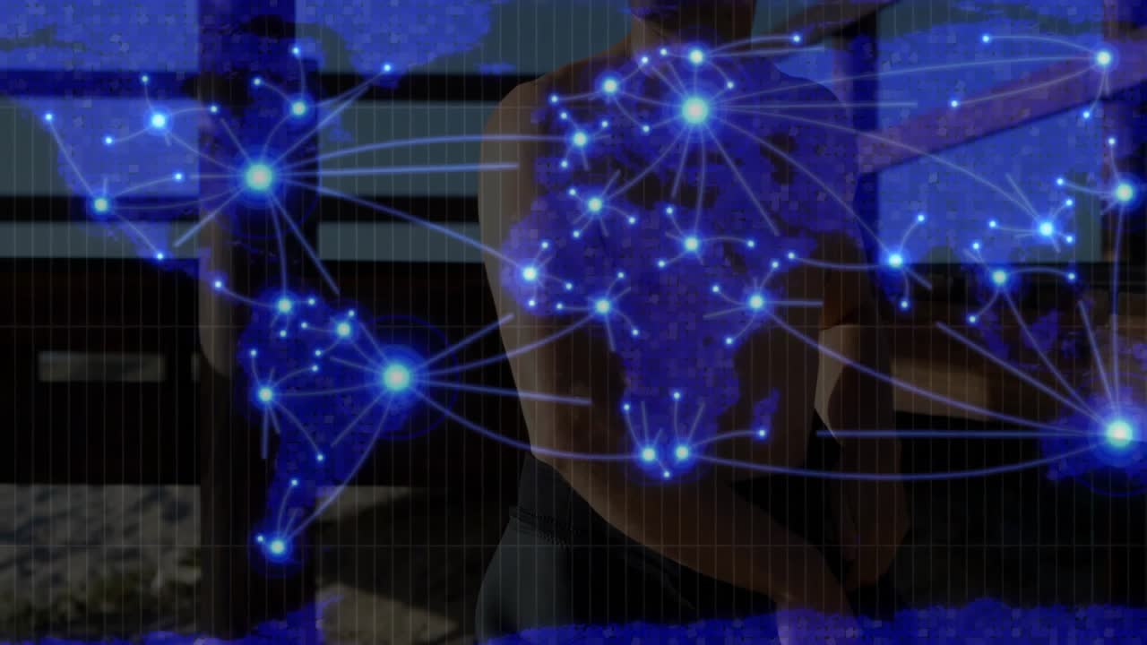 Shirtless man standing indoors, showing holographic world map network graphic for technology design