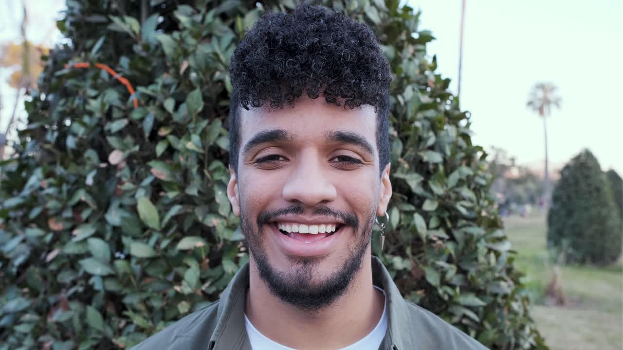 Portrait of a smiling man in a park