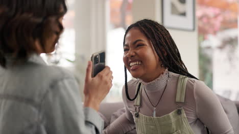 two friends laughing and taking photos