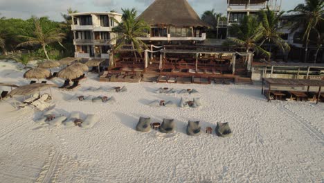 tulum, mexico: amansala resort with beachfront huts and serene palm ambiance - aerial