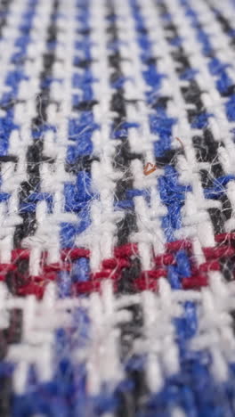 colorful woolen plaid with pattern as background extreme close view. elegant handmade blanket covering bed. handicraft item for housekeeping