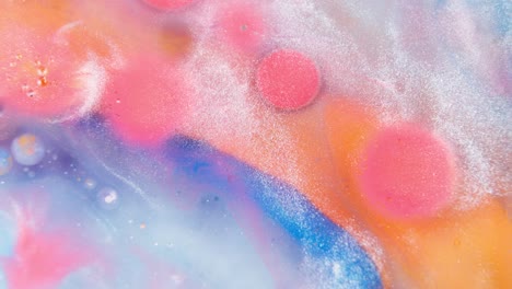 color tablets dissolving in colorful abstract pattern liquid ink fluid