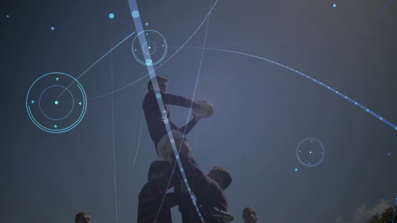 Rugby players lifting teammate with digital data processing animation overlay