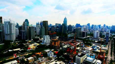 4k.aerial central park in bangkok, thailand green with lake.golf course and business center.central park - in bangkok - lumpini park