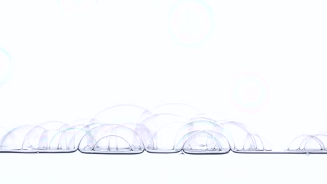 soap bubbles fall on the surface of the water 1