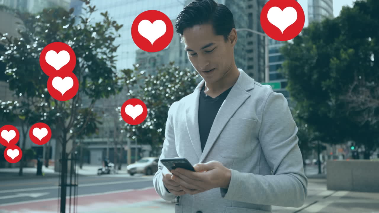 길 위에 서서 스마트폰을 사용하는 두 인종 사업가 위에 떠다니는 심장 모양의 애니메이션