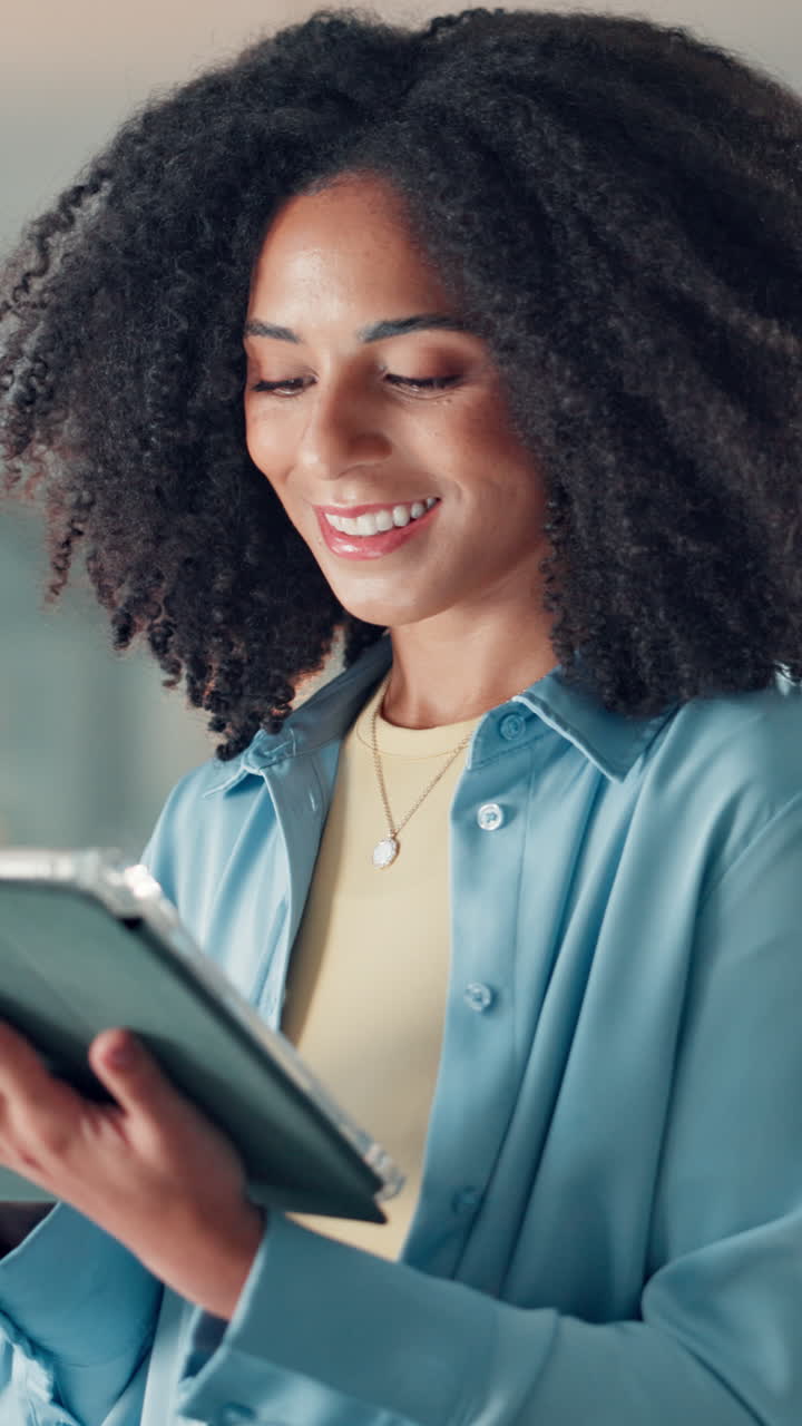 Smiling Young Woman Using Digital Tablet for Work