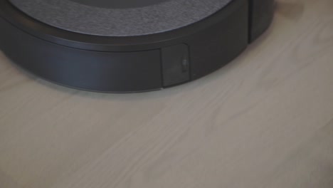 a robot vacuum in operation - close up