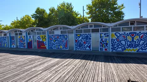 colorful graffiti on waterfront buildings in pauillac, france