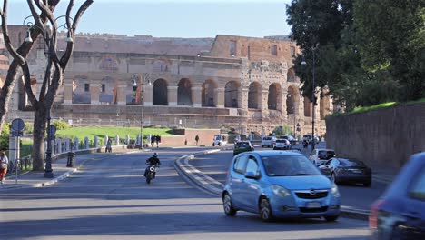 street traffic near the colosseum, rome, italy busy tourist area