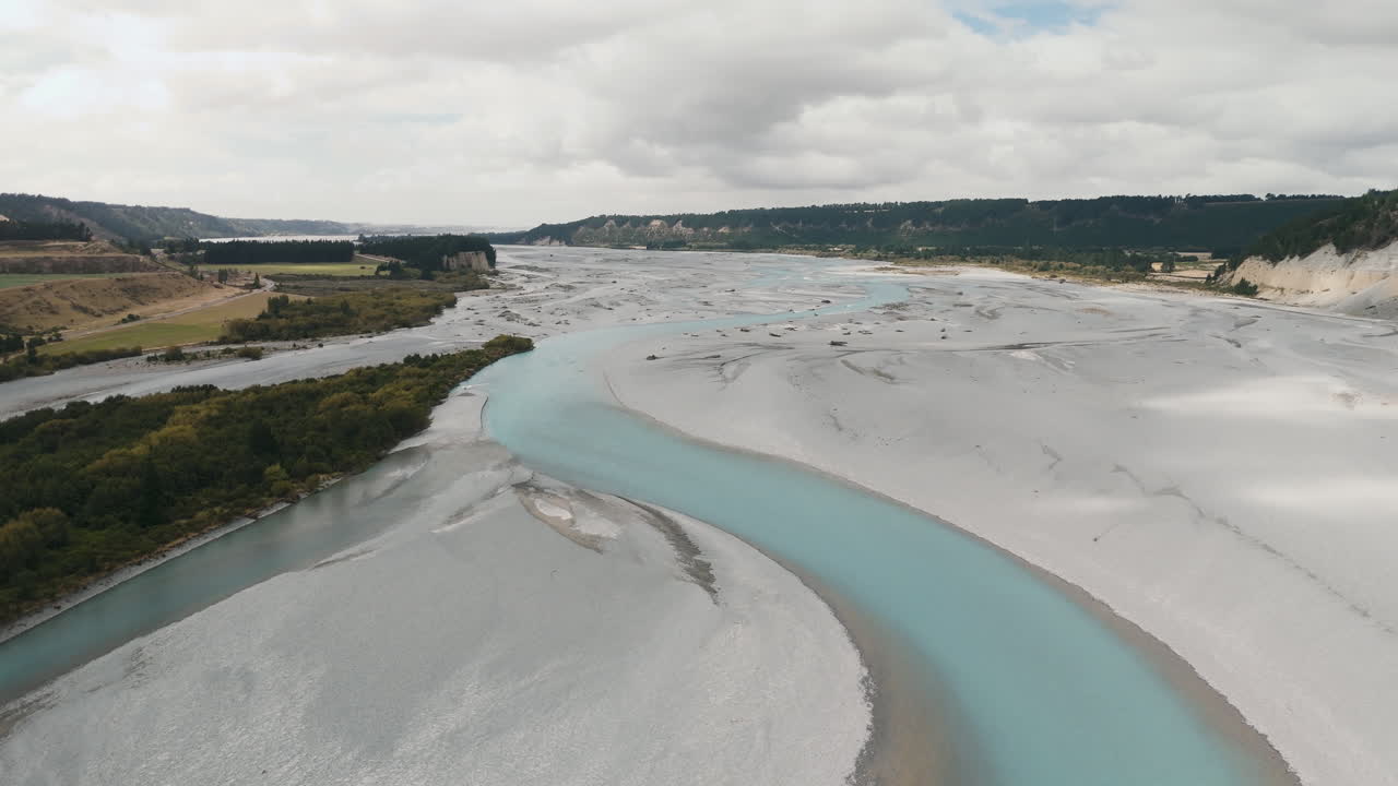 Aerial View of a Turquoise River and Dry Riverbed in New Zealand
