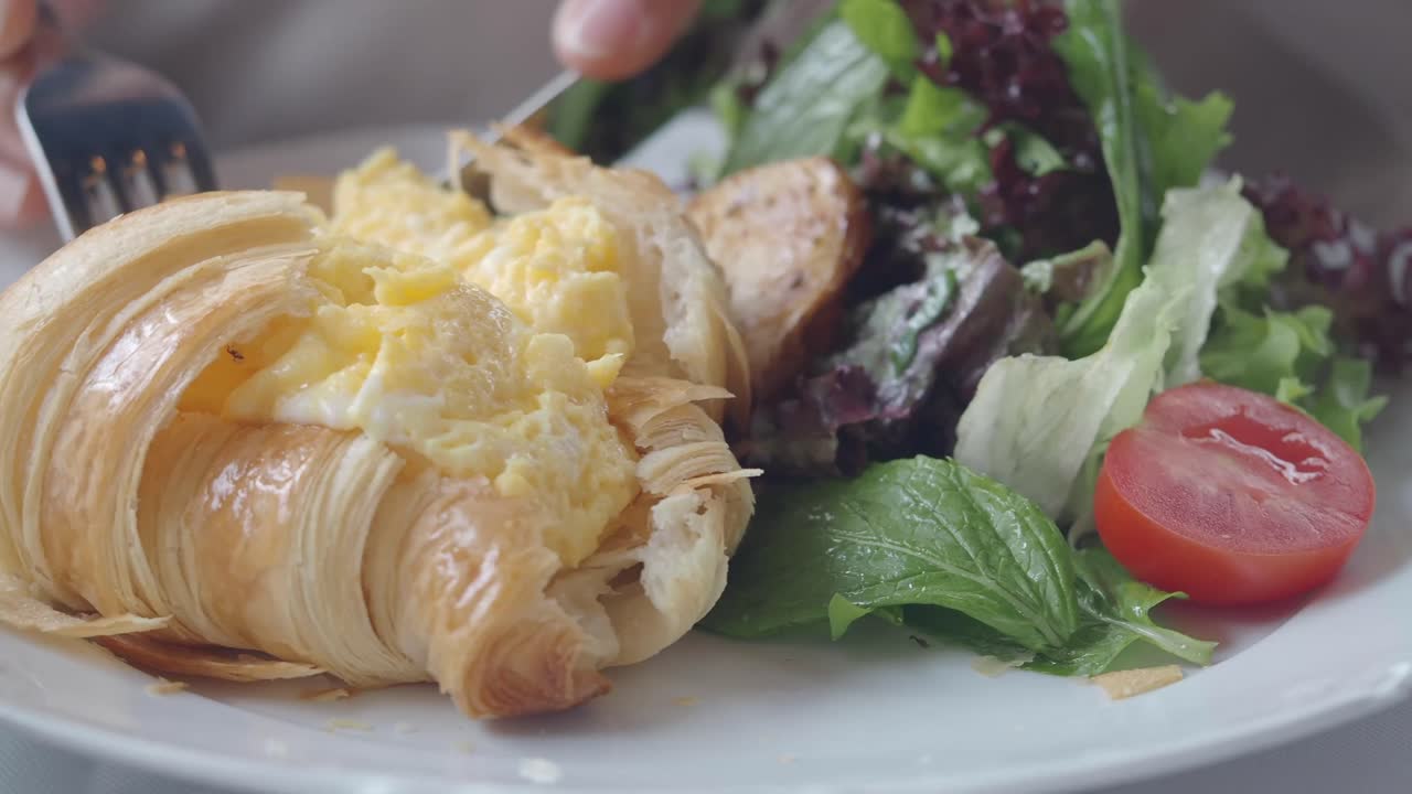 Croissant with Scrambled Eggs and Salad