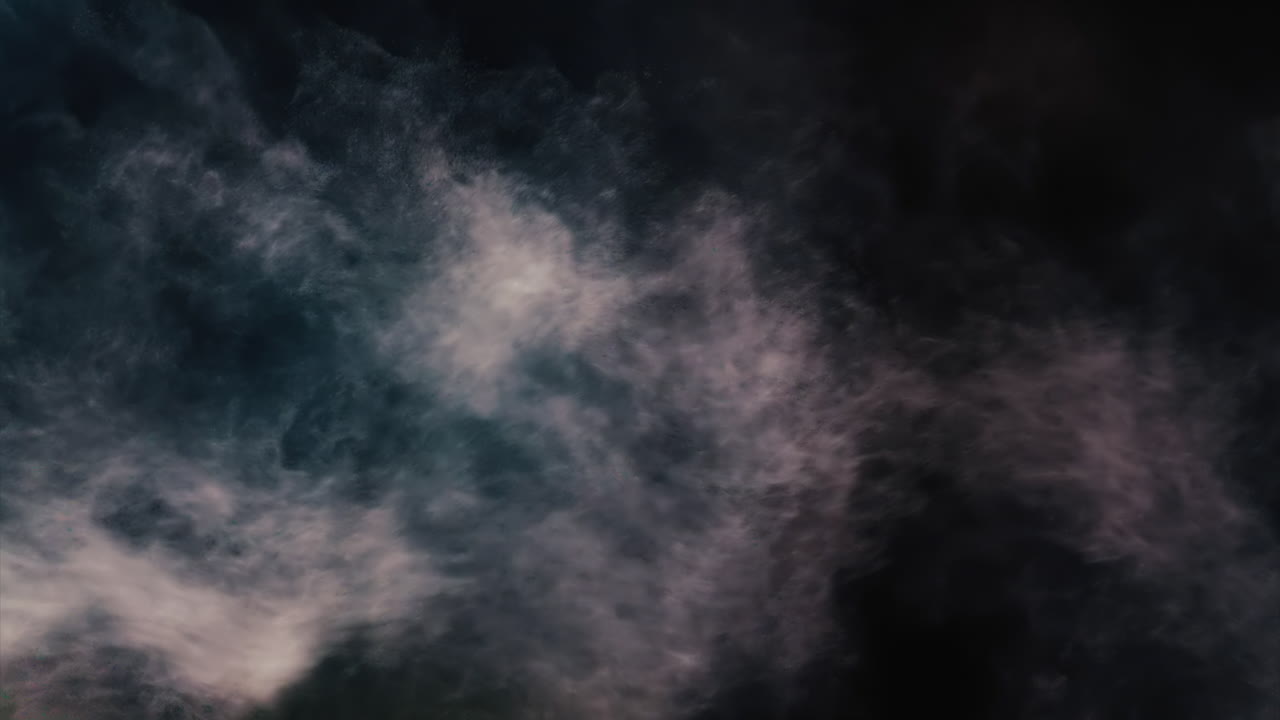A jet of water spraying into the air against a dark background