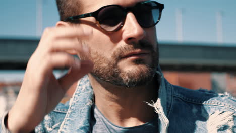 man in denim jacket and sunglasses