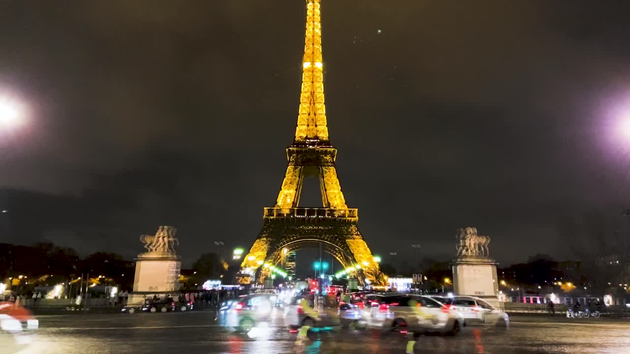 Walking In The Street At Night With A View Of Eiffel Tower. Eiffel Tower At Night In Paris, France.  - hyperlapse