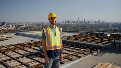 construction worker on rooftop with city view