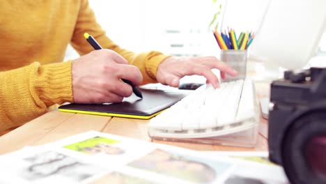 Hipster businessman working at his desk