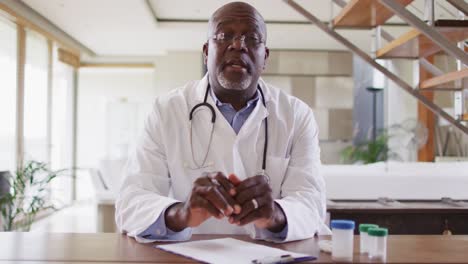 african american senior male doctor making video call consultation