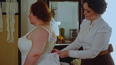 woman being fitted with a corset