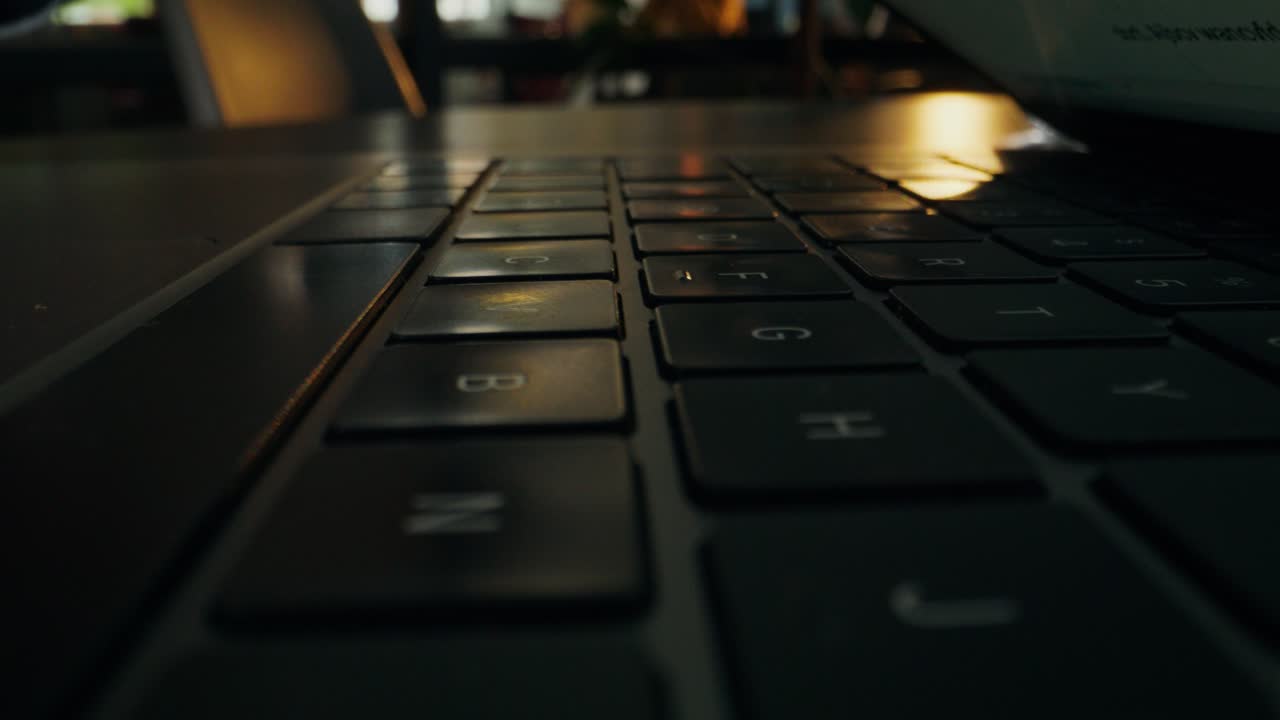Person Typing on a Laptop Keyboard