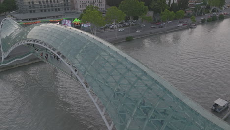 drone view of the peace bridge, a pedestrian bridge in tbilisi, georgia, usa