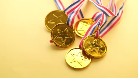 golden medals with ribbons