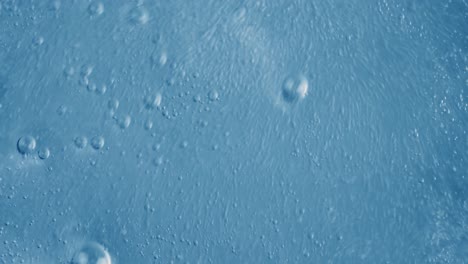 oxygen bubbles in water on a blue abstract background