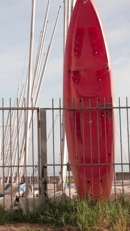 surfboards resting on fence in barcelona in vertical