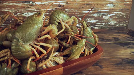 live crayfish on a wooden table