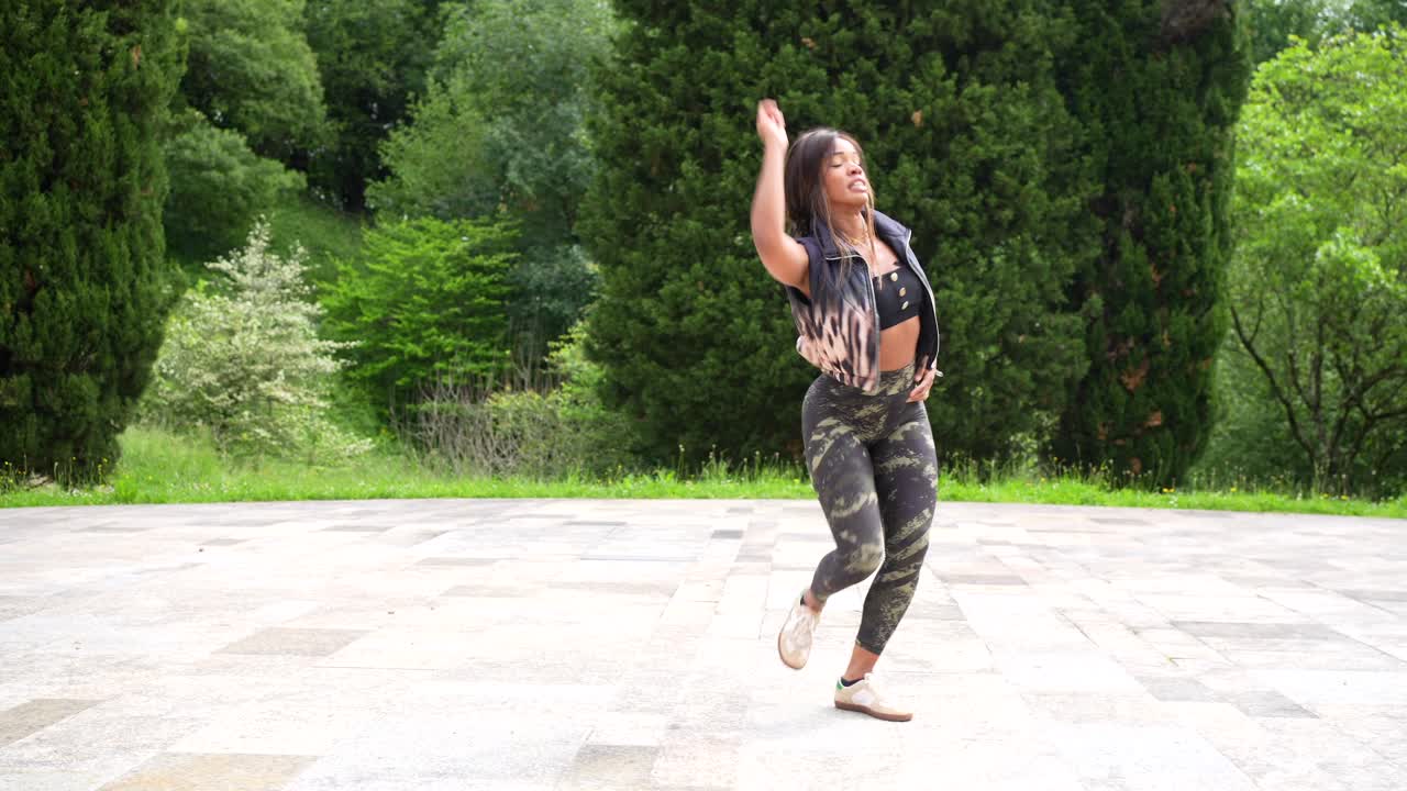 Woman Dancing Outdoors in Park
