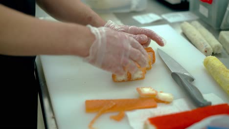 Cook-serves-a-Japanese-roll-with-salmon