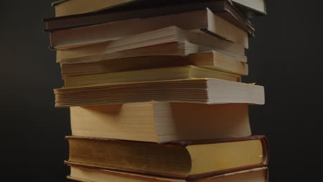 pile of books spinning with the camera tilting