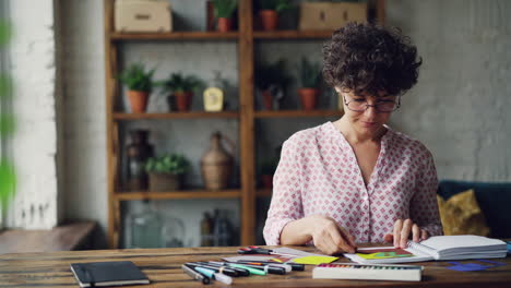 woman engaged in paper craft project