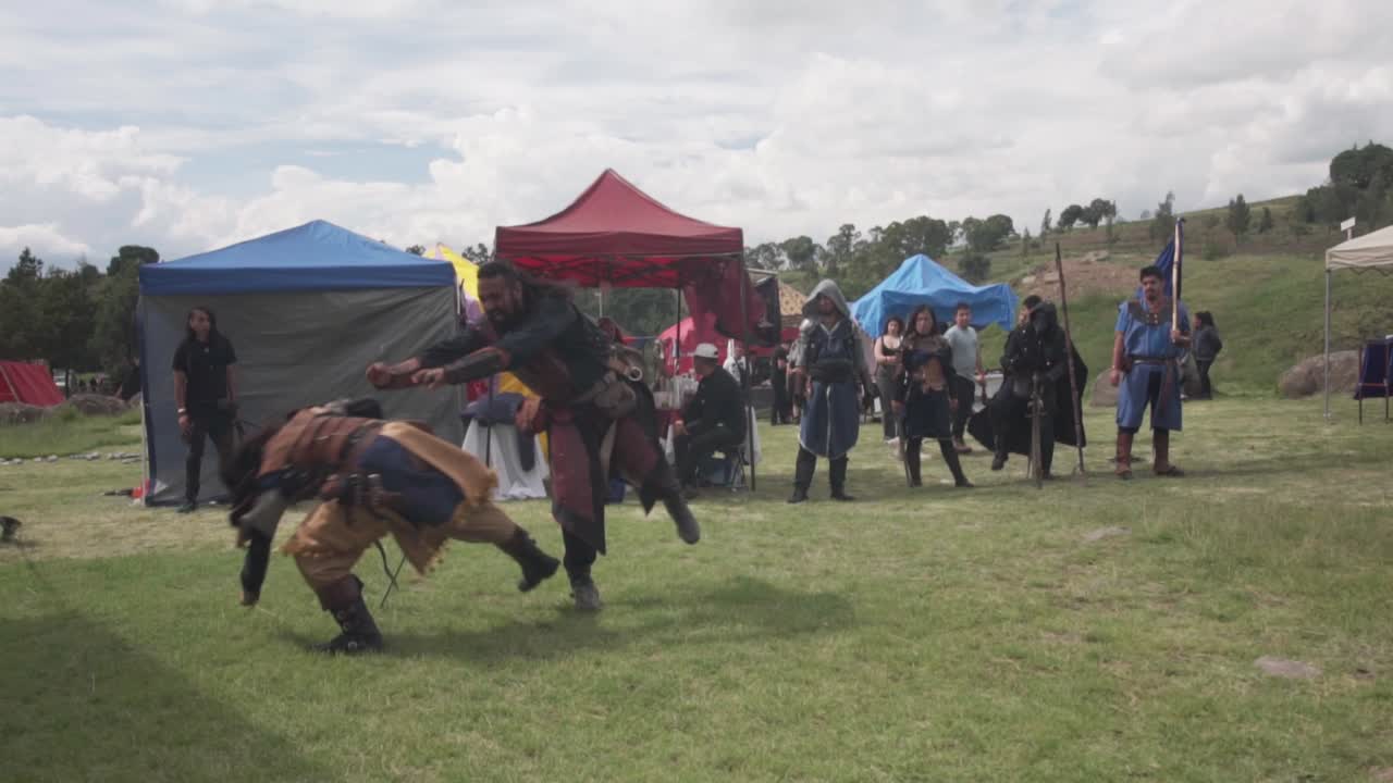 Warriors fighting with swords in medieval festival demonstration