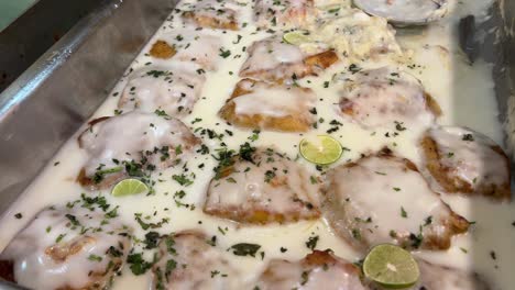 Close-up-shot-of-popular-bengali-style-fish-dish-called-lemon-fish-on-display-at-a-function